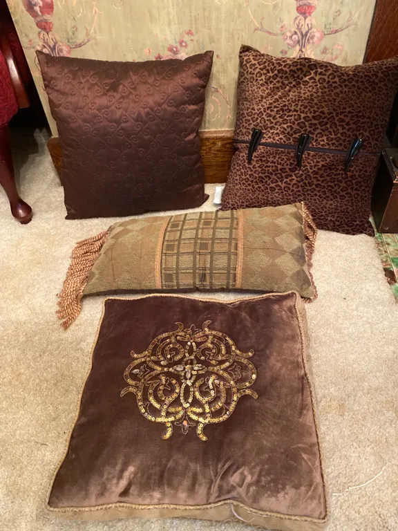 4 Decorative Throw Pillows in Various Patterns and Fabrics