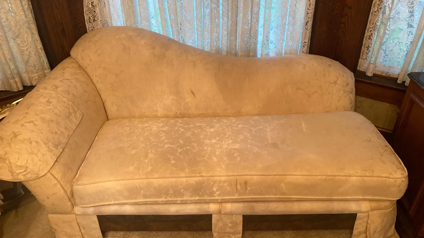 Upholstered Chaise Lounge with Cream Floral Fabric and Curved Backrest