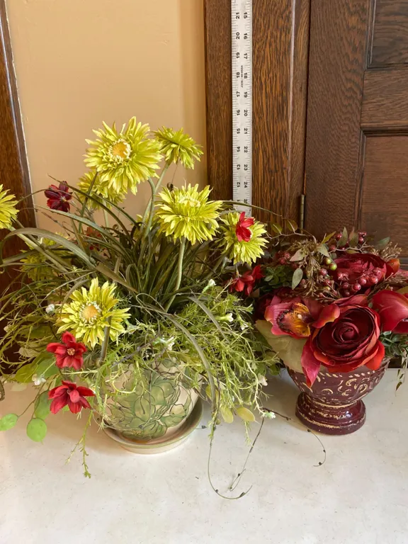 2 Floral Arrangements in Decorative Ceramic Containers