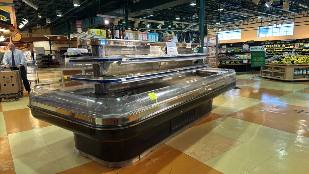 2000 Tyler RCCG3 6012 R 3-deck refrigerated island display case. Features multi-tier shelving, bumper rails, and top dry display deck. 12'L. S/N: 2850