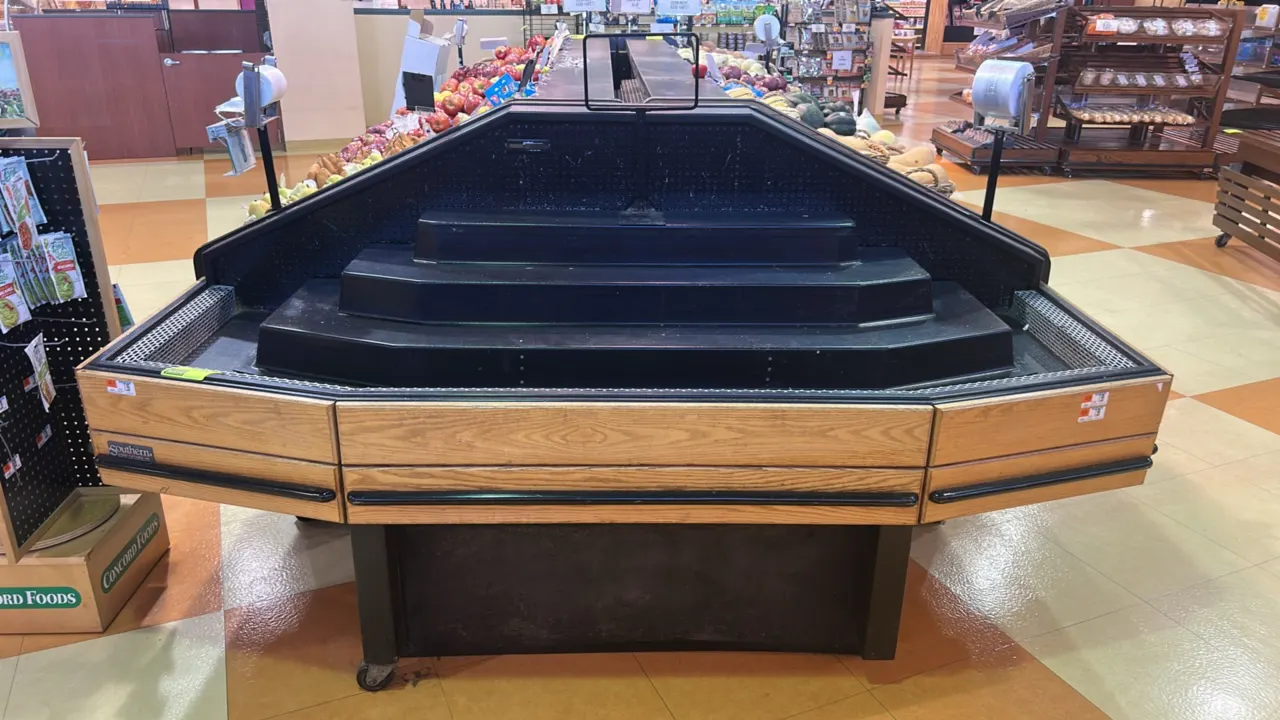 Southern Case Arts self-contained refrigerated produce merchandiser. Features a multi-tier stepped display deck, oak-finish exterior paneling, and pro