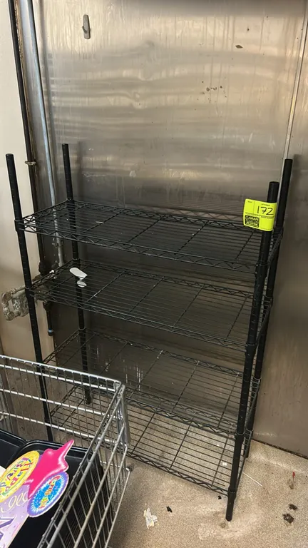 Metal wire multi-tier shelving rack. Features 4 adjustable wire shelves and a black finish. Dimensions: 36"W x 14"D.