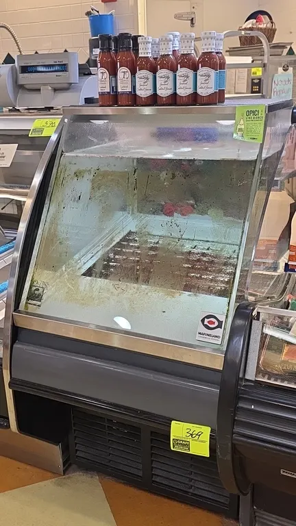 Marineland self-contained lobster display case. Features curved front viewing window, hinged top access lid, and bottom ventilated refrigeration compa