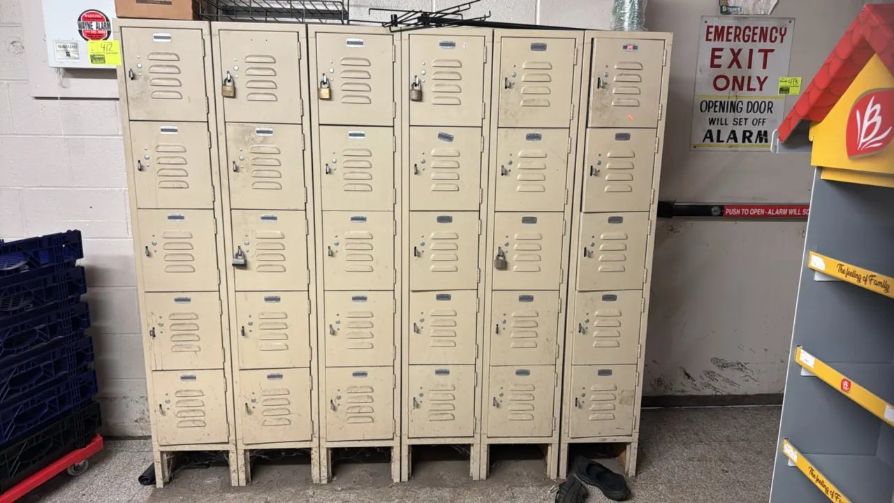 Lockers.com metal locker sections. Features 5-tier box locker design, louvered doors for ventilation, pull latch hasps, and tan finish. 12" x 15" x 66