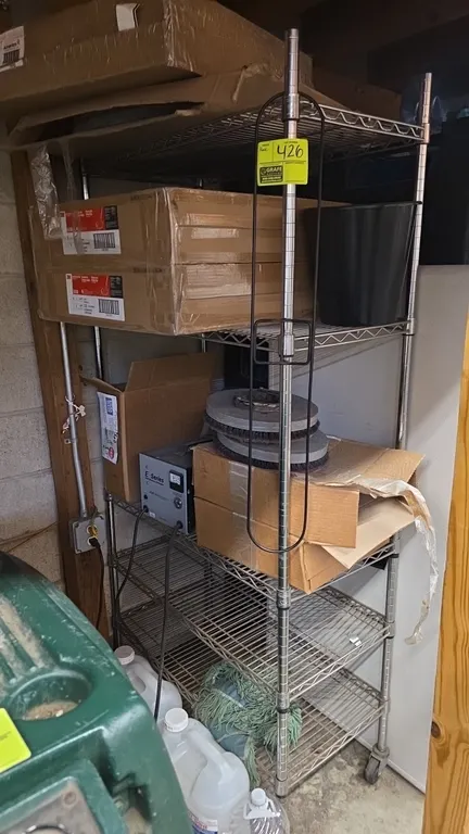Portable 5-tier metal wire shelving rack. Features chrome wire construction with 5 adjustable shelves. 36" x 18" x 76". Mounted on casters. Contents n
