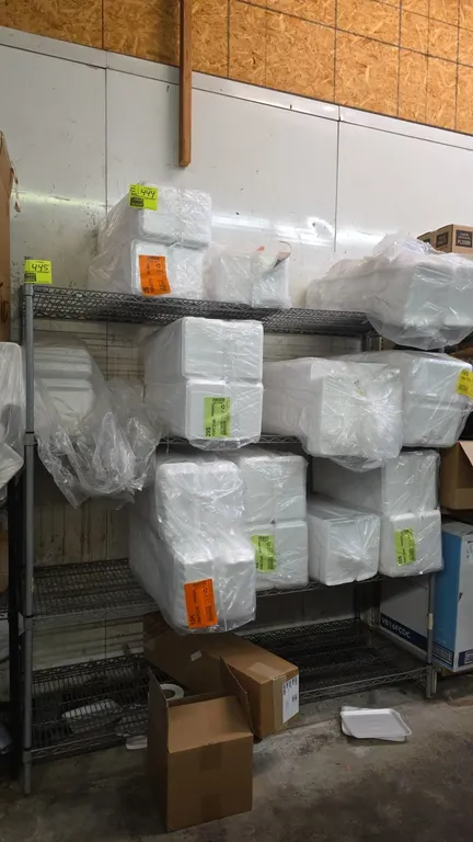 TSS 4-tier wire shelving rack. Features gray metal construction with 4 wire shelves. Dimensions: 72" x 24" x 75". Contents not included.