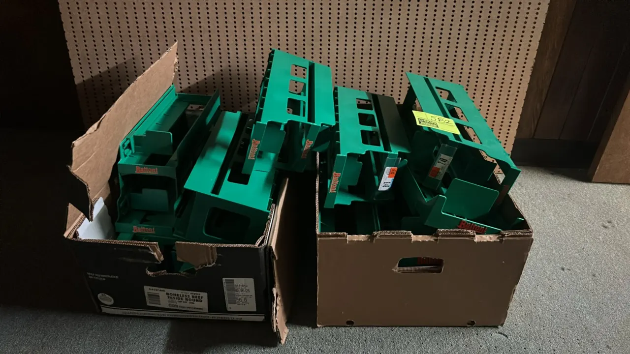 Assorted green plastic product pusher racks. Features molded poly construction with spring-loaded pushers and Buitoni branding. Packed in two cardboar