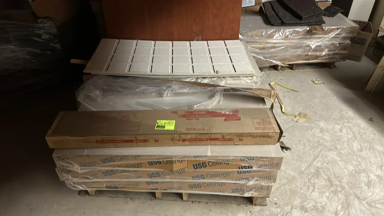Assorted ceiling tiles and suspension components on (2) pallets. Includes USG Ceilings acoustic ceiling tiles, DONN suspension system cross tees, deco