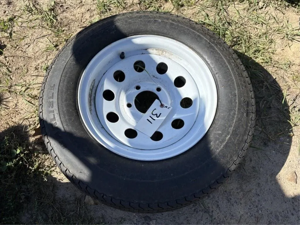 (1) ST215/75 R14 Tire w/rim