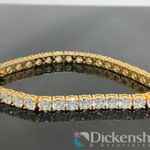 Gold Tone Tennis Bracelet With Clear Stones