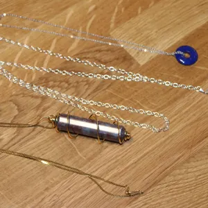 Two Pendulum Necklaces with Stone and Crystal Pendants