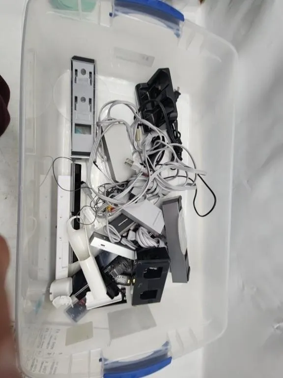 Bin of Game Console Cables and Accessories