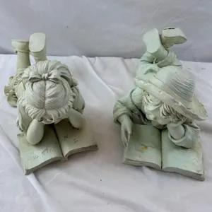 Pair of Child Reading Book Sculptures