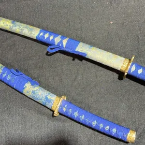 Two Japanese-Style Swords with Blue and Gold Decorative Scabbards