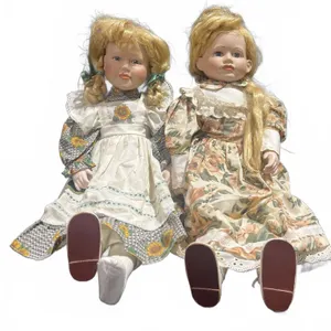 Porcelain Dolls in Floral Dresses with Blonde Hair and Painted Faces