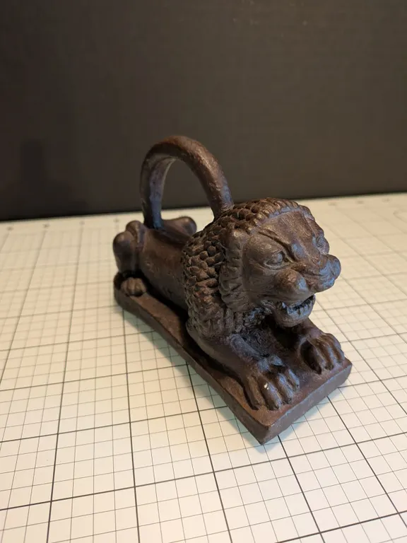 Assyrian lion weight replica with felted base in great condition.