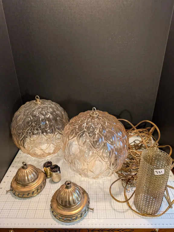 Pair of mid century modern swag pendant lights. Includes metal caps, one internal metal cylinder dif