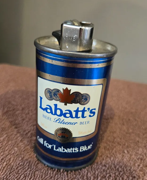 Vintage Labatt's Blue Pilsener Beer metal can. Retrofitted as a Cricket lighter holder. 3 1/2" tal