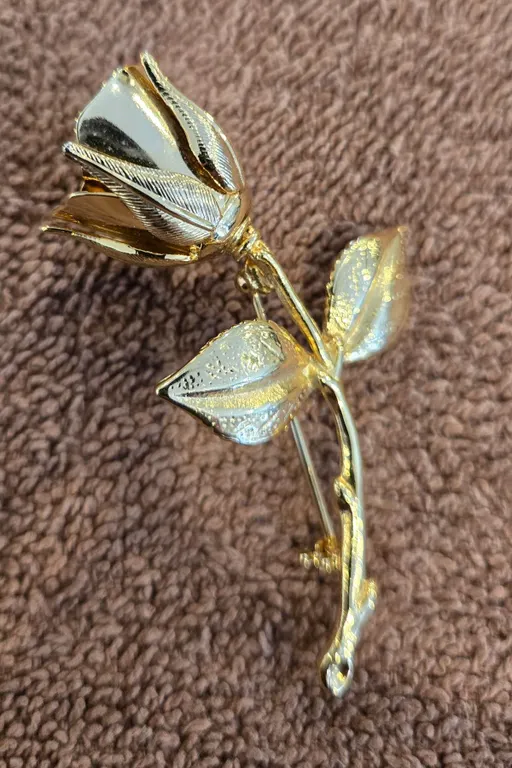 Vintage gold tone metal rose brooch. 1980s, 2 1/2" long.