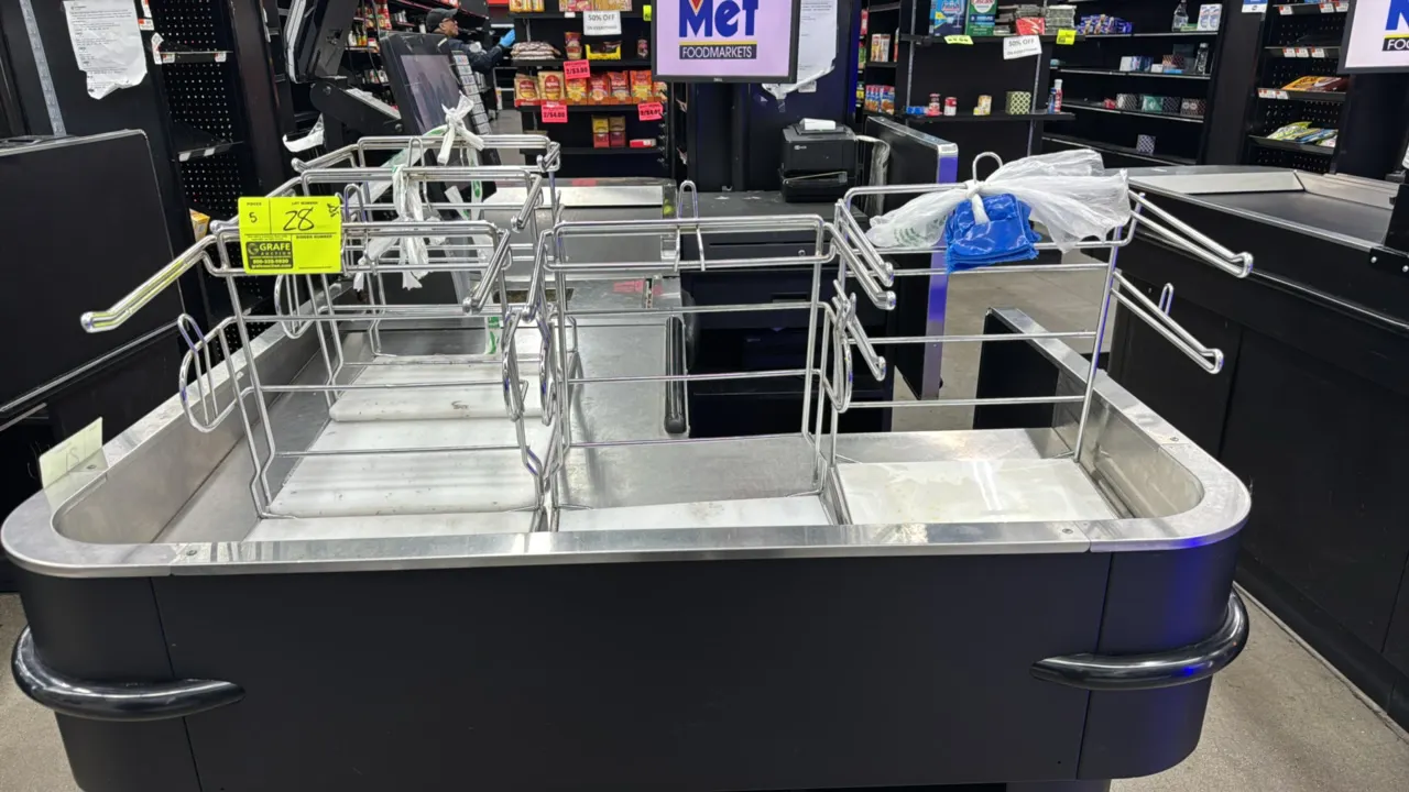 Chrome wire checkout bag stands. Features wire construction with support arms designed for plastic t-shirt grocery bags. Note: Checkout counter and ba