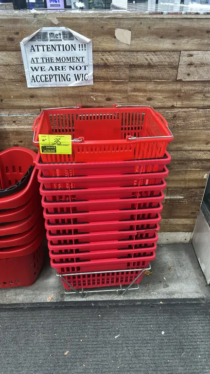 Poly shopping baskets. Features red molded polymer construction and dual folding wire handles. 19"L. Includes metal wire floor stand. Note: Other bask