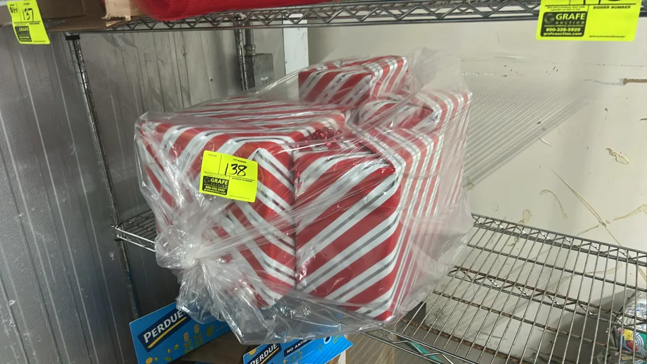 Christmas holiday decorative gift box displays. Features assorted wrapped display boxes with red and silver-tone diagonal stripe patterns. Contained i