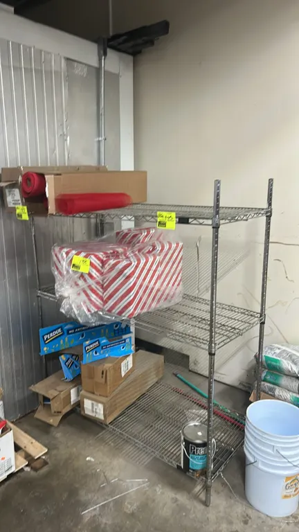 Metal wire 3-tier shelving rack. Features chrome-finished wire construction and three wire shelves. 53" x 24". Contents not included.