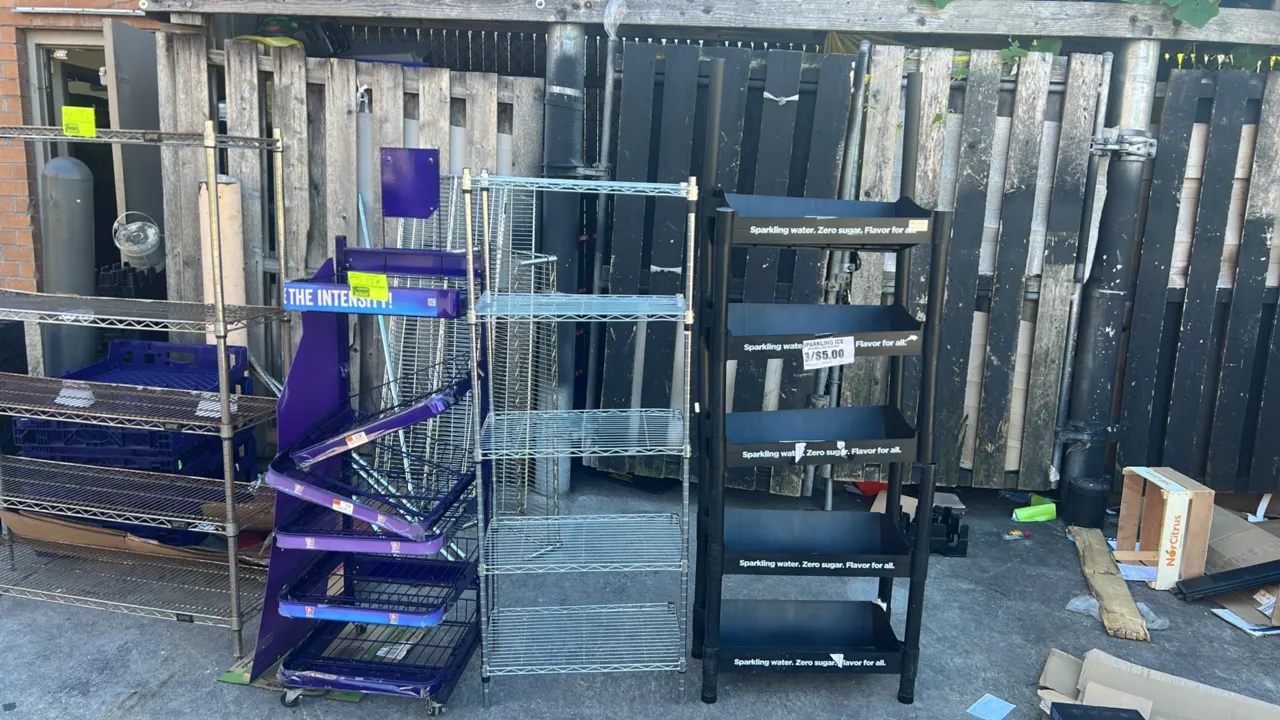 Assorted retail display merchandisers and wire shelving racks. Includes multi-tier chrome wire shelving units, branded retail product display racks (S