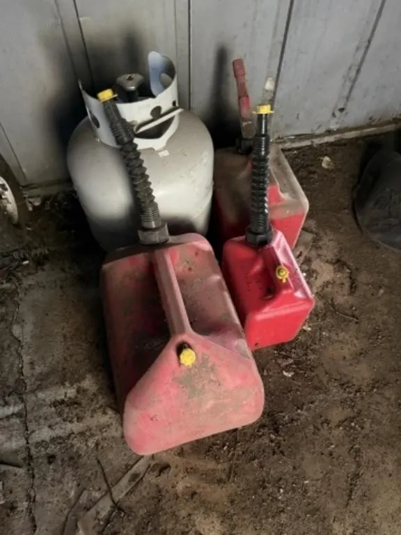 3 Gas Cans, Mostly Empty Propane Tank