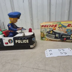 Marusan Battery-Operated Tin Police Car with Plastic-Head Driver, Model 6167, with Box, 9”