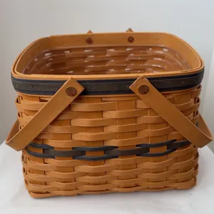 A 1998 Longaberger Collectors Club Harbor Basket featuring double swing/swivel handles w/protector