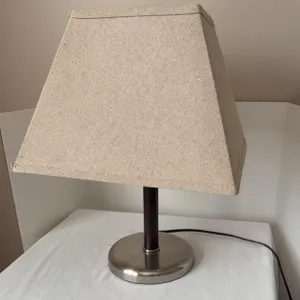 Table touch lamp with a brushed metal round base