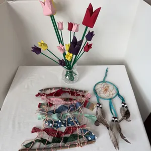 Home decor, including wooden bouquet of tulips, dreamcatcher, and wall hanging