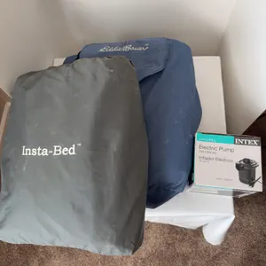 Pair of full-size inflatable mattresses with air pumps.