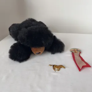 Lot of collectibles: Ohio State fair pin, gold horse and a stuffed black bear