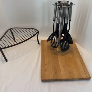 Kitchen counter items. Corner stand, cutting block and utensil holder with utensils