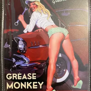Retro-style Grease Monkey Garage Pin-Up Metal Tin Sign