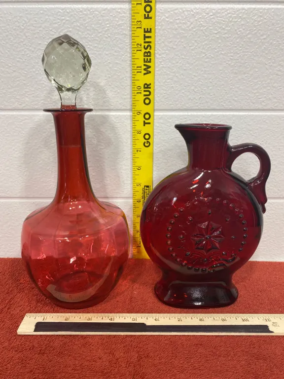 Two Red Glass Decanters With Stopper and Jug, Mid-20th Century