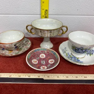 Decorative Cups, Saucers, and a Pedestal Dish