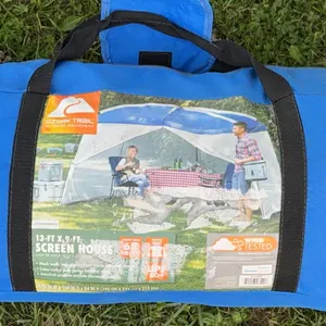 Ozark Trail 13' x 9' Screen House packed inside its blue zippered carry bag.