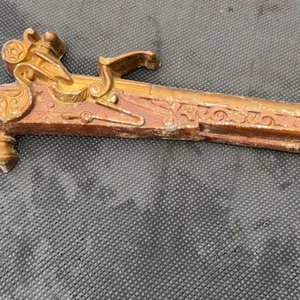 Vintage decorative cast metal flintlock pistol wall hanging