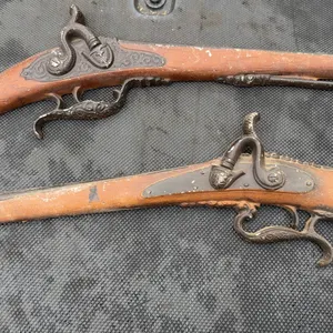 Pair of non-firing replica Sexton flintlock pistols crafted with cast metal parts.