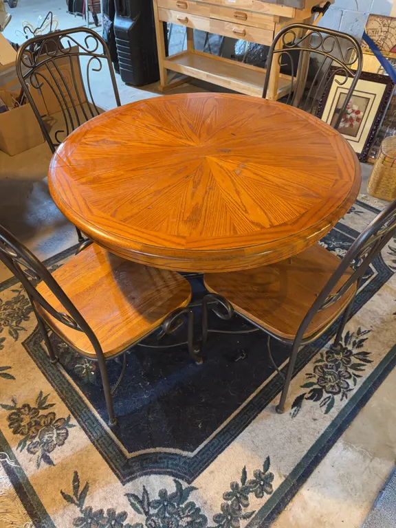 Round Dining Table with Leaf and 4 Scrollwork Metal Chairs