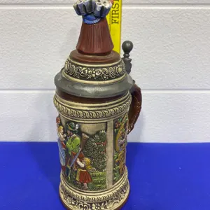 Erbo Zinn Lidded Beer Stein with Figural Handle and Relief Decoration