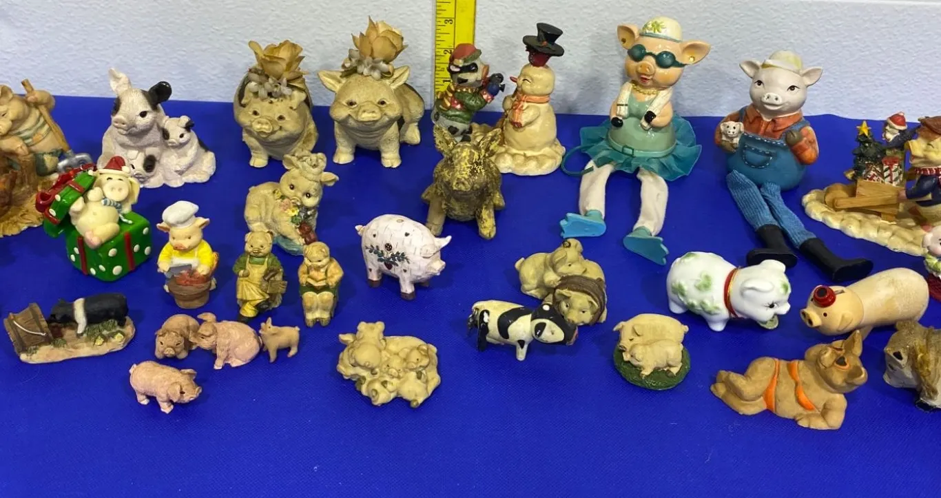 Pig Figurine Collection Featuring Various Materials and Styles