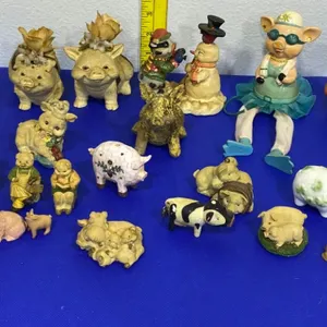 Pig Figurine Collection Featuring Various Materials and Styles