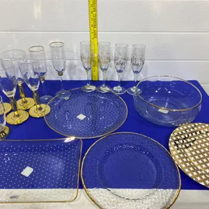 Glassware and Plates With Gold Accents, Including 2007/2020 Champagne Flutes
