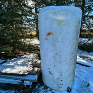 White plastic upright tank c/w misc. lumber & tin