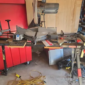 Craftsman brand 10-in miter saw mounted to The Rolling cutting stand