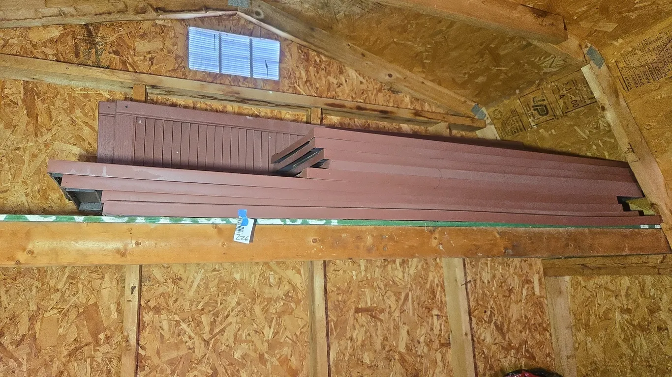 Large assortment of red plastic house shutters